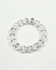 Clear beaded bracelet on a light gray background